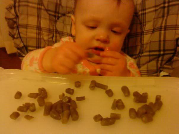 Ella eating green beans