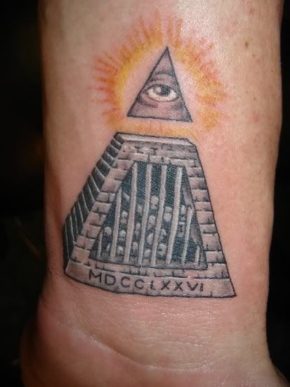 3d lotus flower tattoo · dead tree tattoo · illuminati. Illuminati tattoo